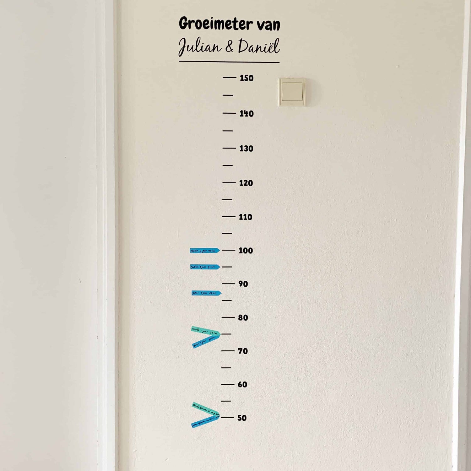 Gepersonaliseerde groeimeter met naam en meetstreepjes
