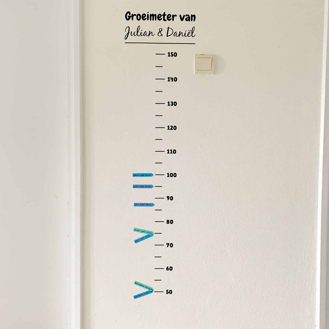 Gepersonaliseerde groeimeter met naam en meetstreepjes